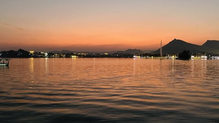 Lake Fateh Sagar, Udaipur, glowing orange at sunset